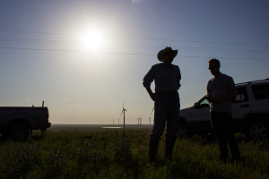 FHMP member Jake Trease (right) speaks with Pete Ferrell, owner of Ferrell Ranch near Beaumont, Kan. and brain behind the Elk River Wind Project, on Ferrell’s ranch on June 17, 2014. (Kevin Brown/Flint Hills Media Project — June 17, 2014)